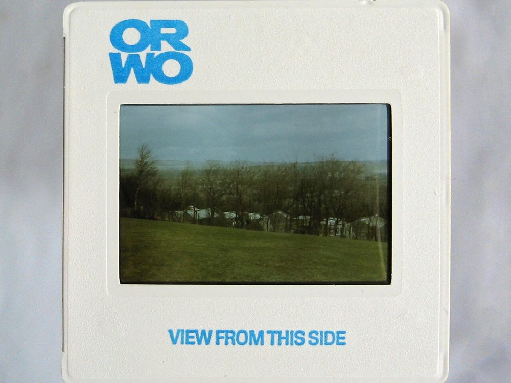 A mounted 35mm slide in a square white cardboard mount
