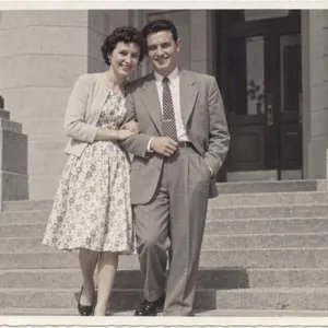 A 1953 print of a couple on the steps of a stone building