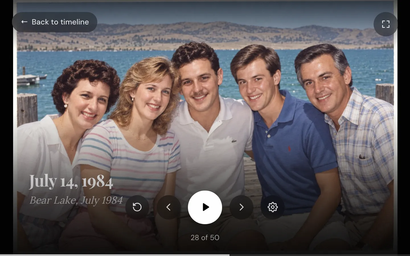 Timeline Scan's slideshow playing full screen: a family photo on a lake dock captioned July 14, 1984, with the note from the back of the print, Bear Lake, July 1984, above the play controls and the count 28 of 50