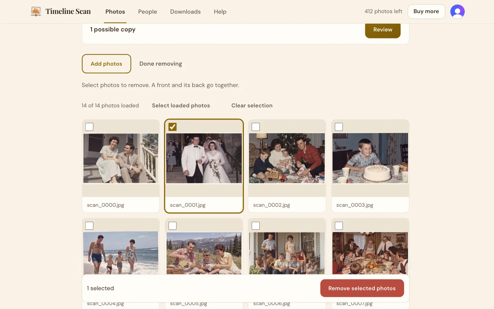 The album's photos with one of them ticked, and a Remove selected photos button below